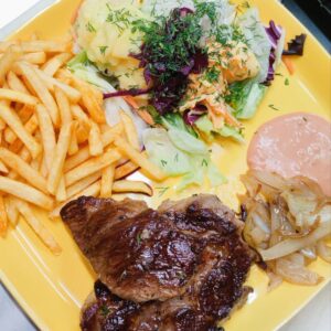 Pork-Neck Steak with French Fries and Salad/Schweinenacken-Steak mit Pommes und gemischtem Salat